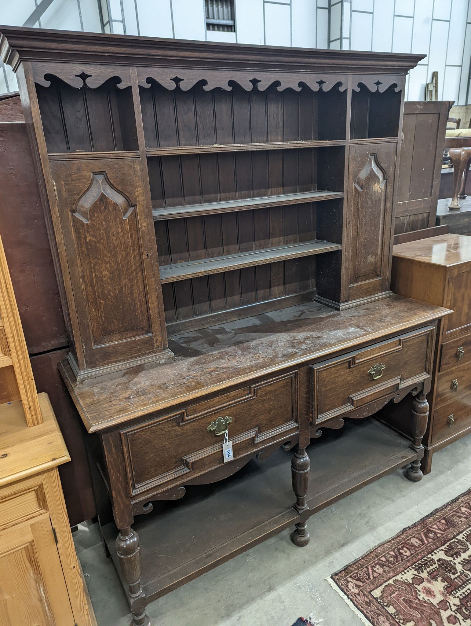 A 1920's oak dresser, length 152cm, depth 49cm, height 188cm